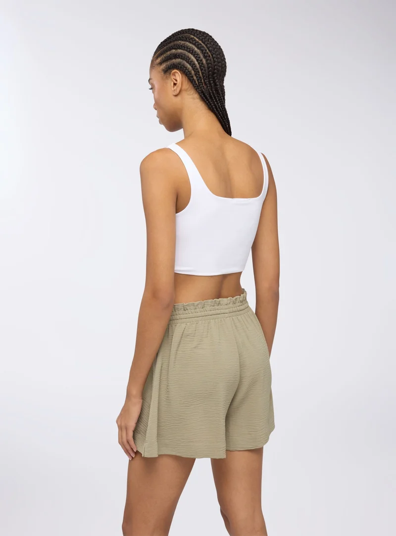 Shorts con coulisse tinta unita