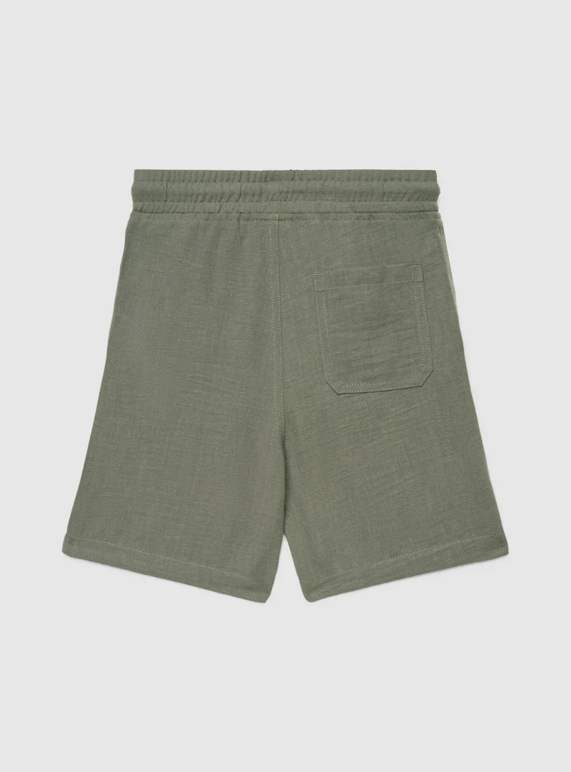 Pantaloncini jogger a tinta unita effetto lino