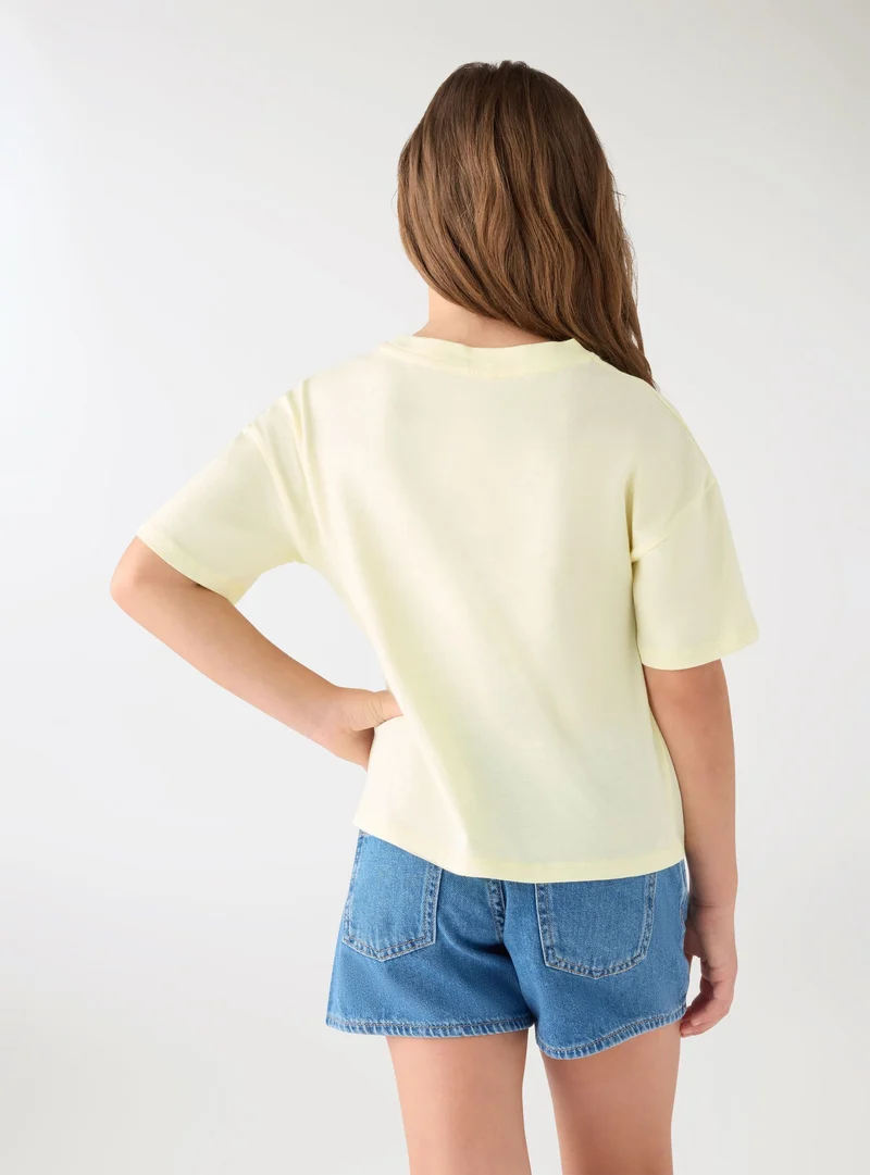 T-shirt crop con stampa
