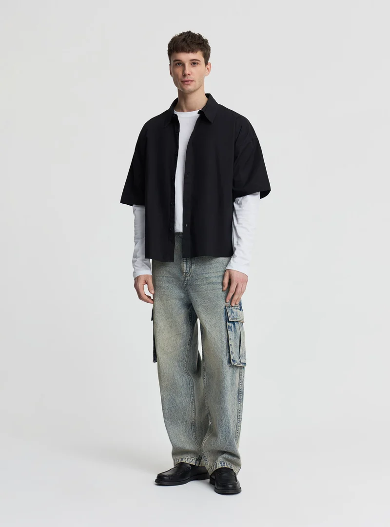 Jeans super baggy cargo a tinta unita