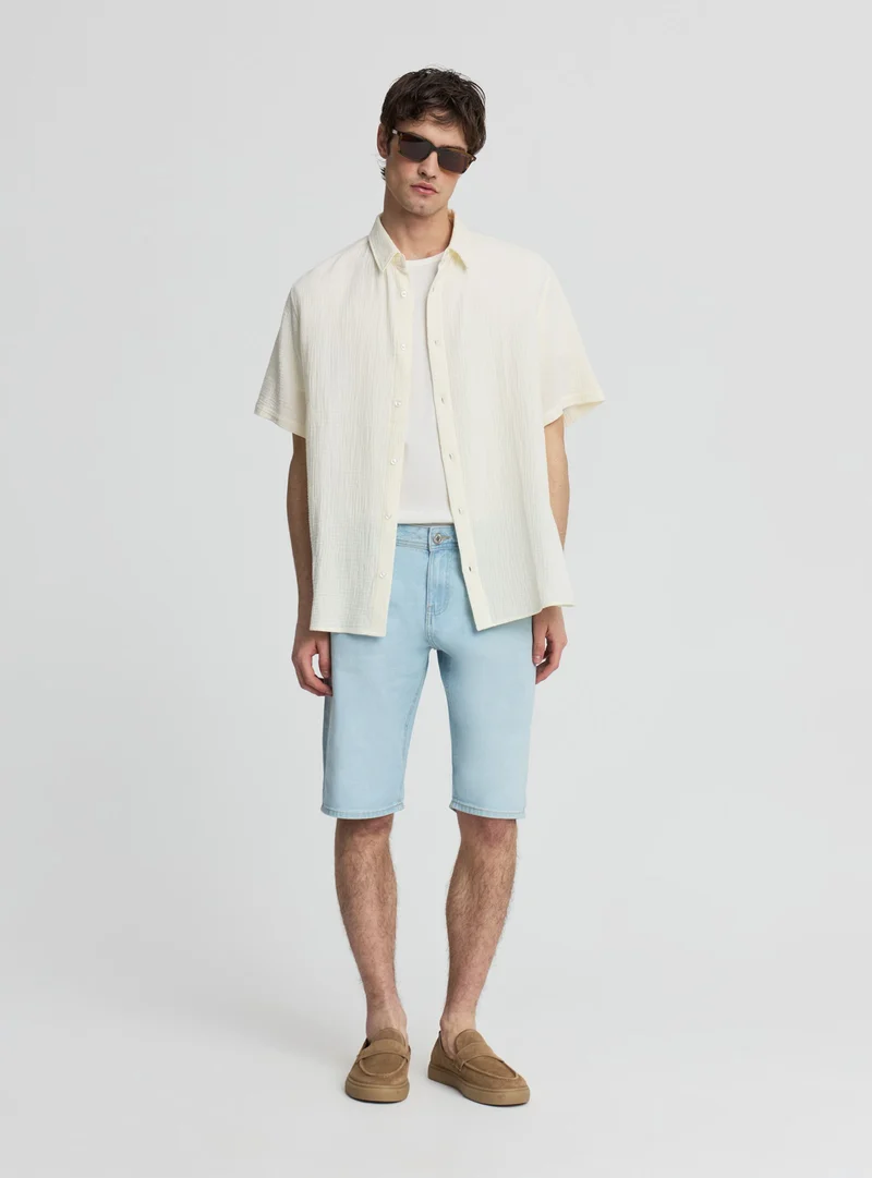 Pantaloncini jeans con risvolto