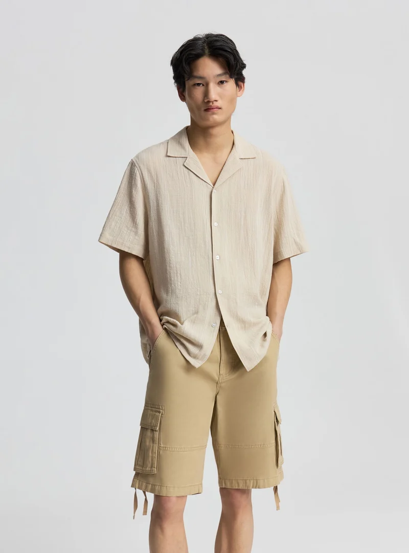 Pantaloncini cargo tinta unita