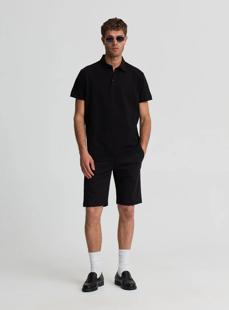 Pantaloncini chinos a tinta unita