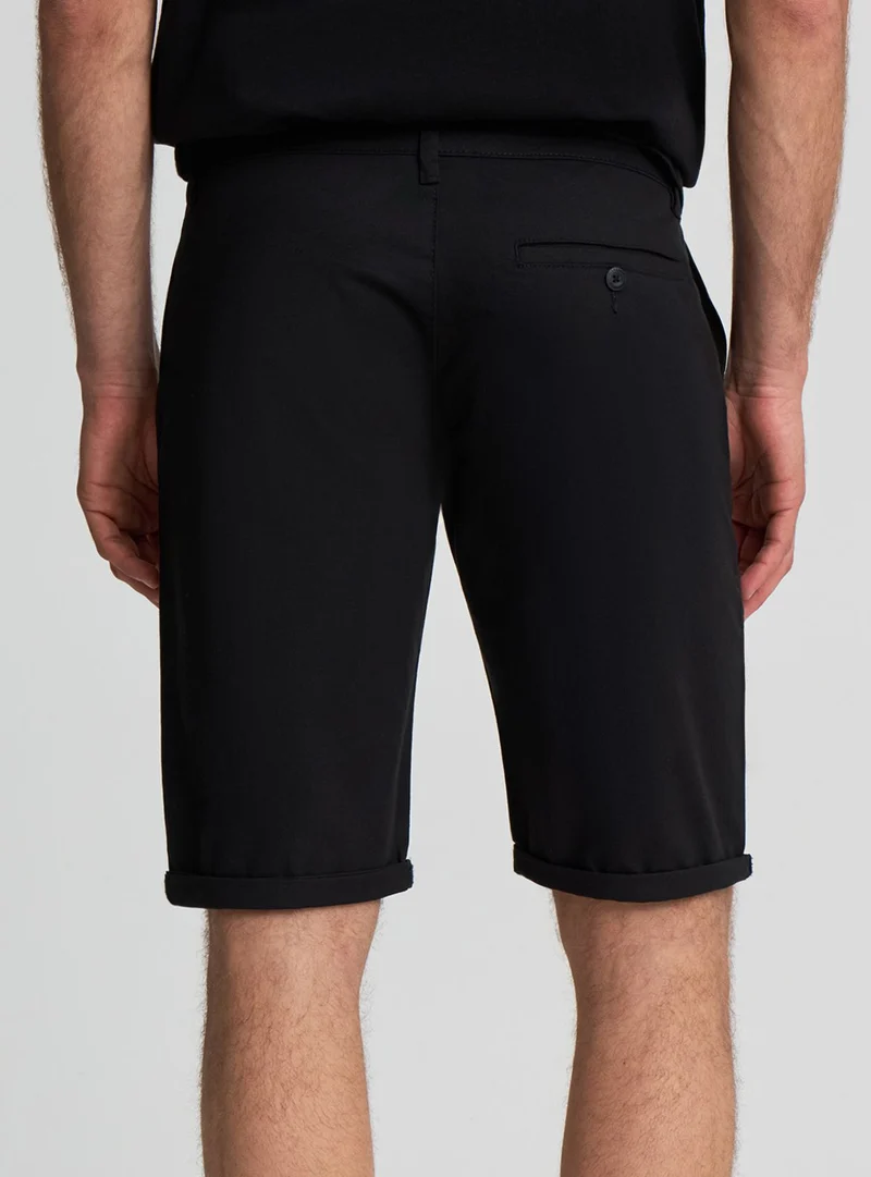 Pantaloncini chinos a tinta unita