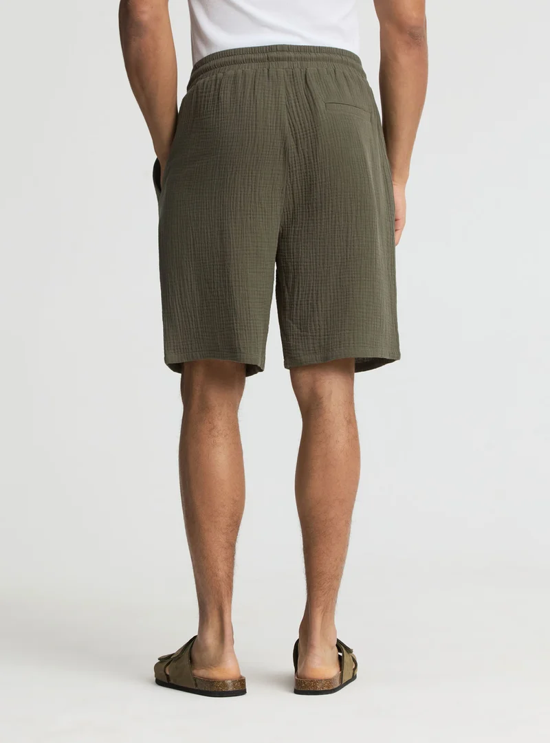 Pantaloncini a tinta unita con coulisse