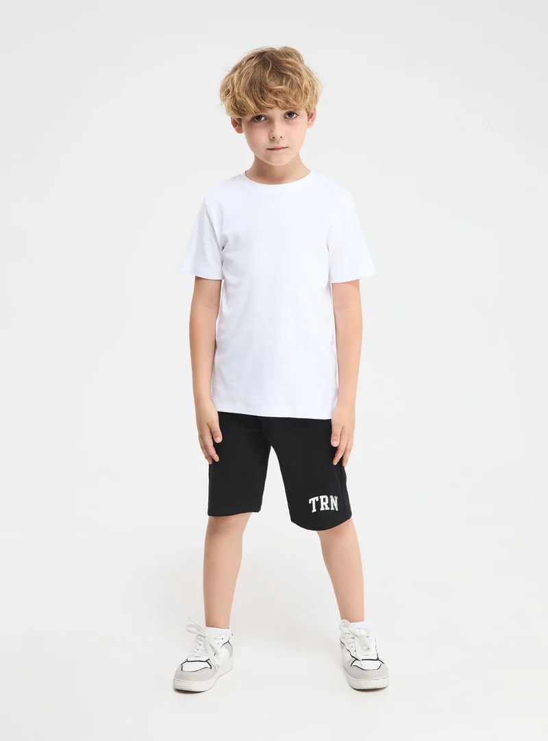 Pantaloncini sportivi con coulisse e scritta