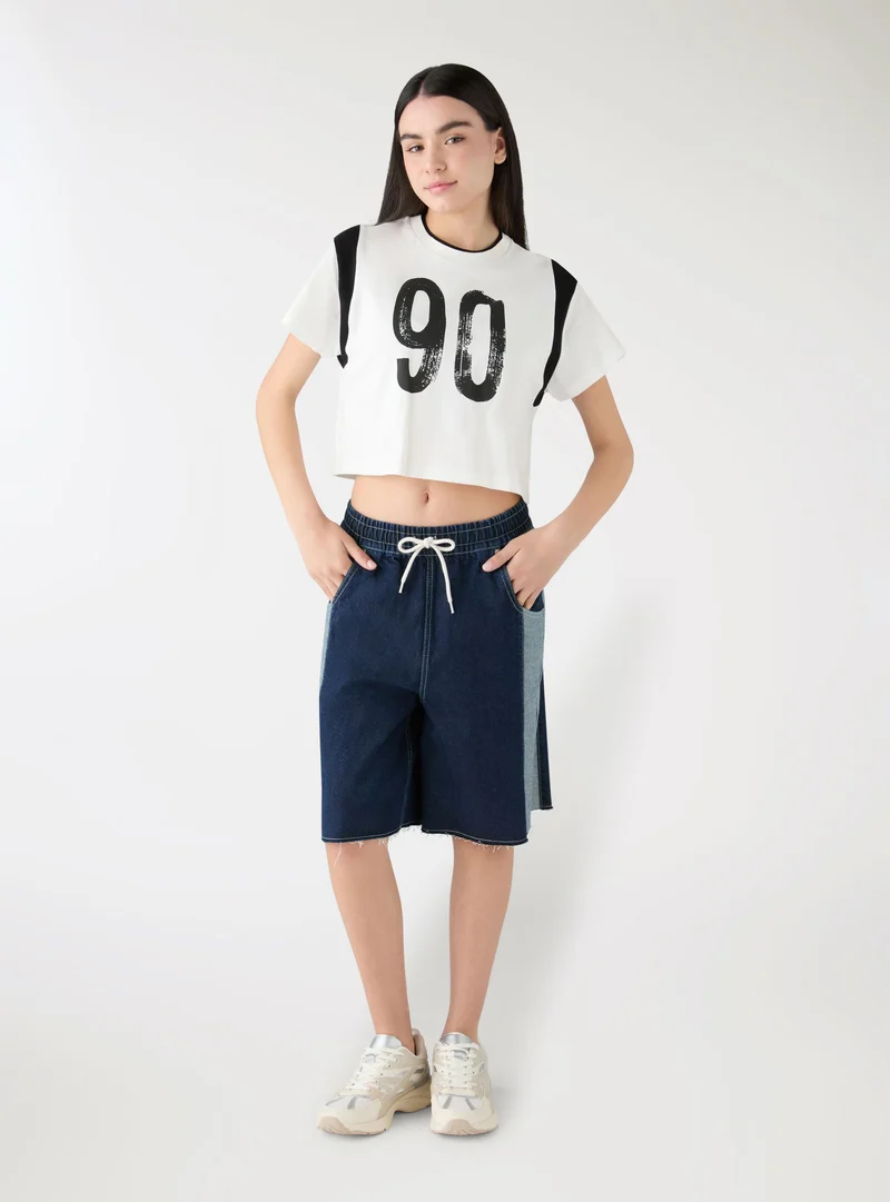 Shorts bermuda in denim con inserti laterali