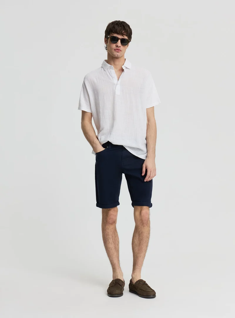 Pantaloncini a 5 tasche con risvolto