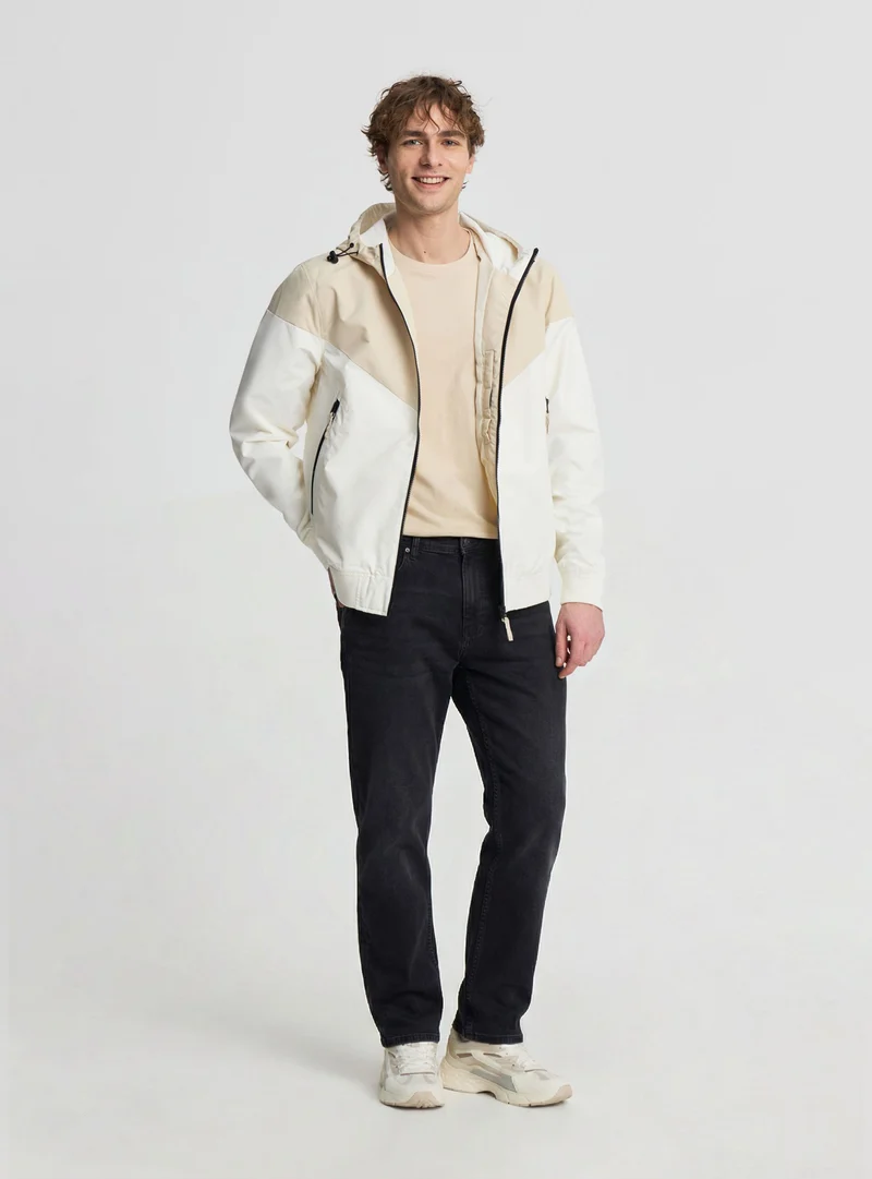 Giubbino leggero con cappuccio block color