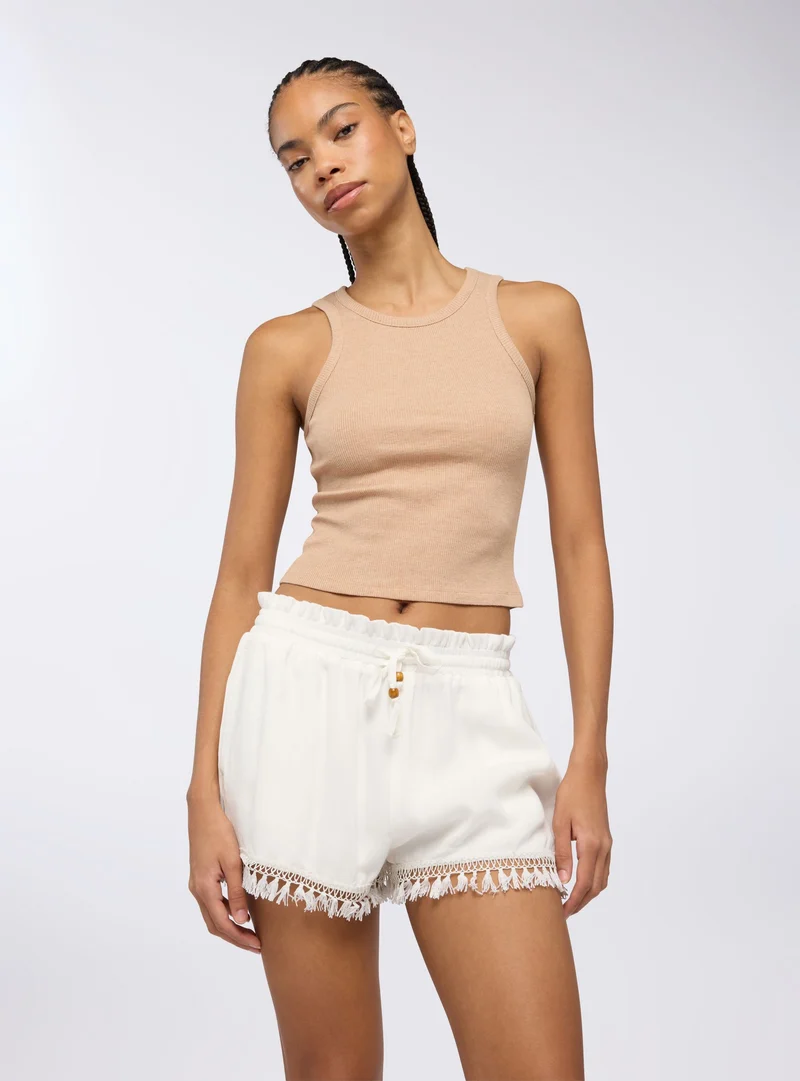 Shorts con passamaneria