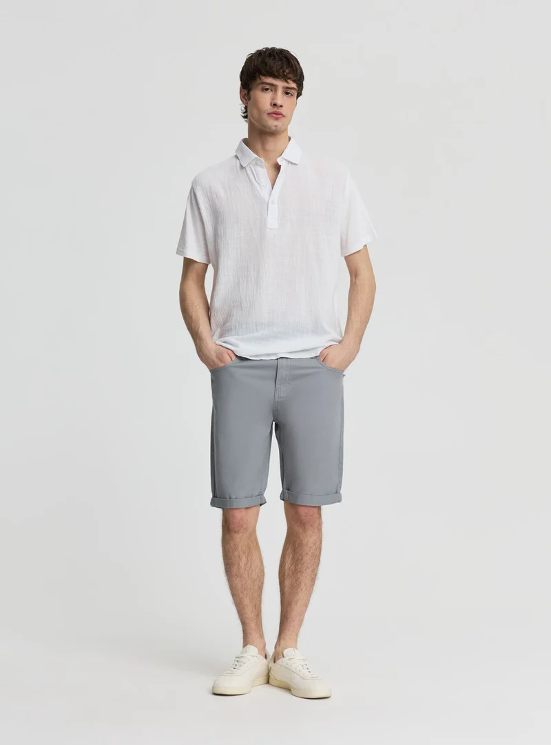 Pantaloncini a 5 tasche con risvolto