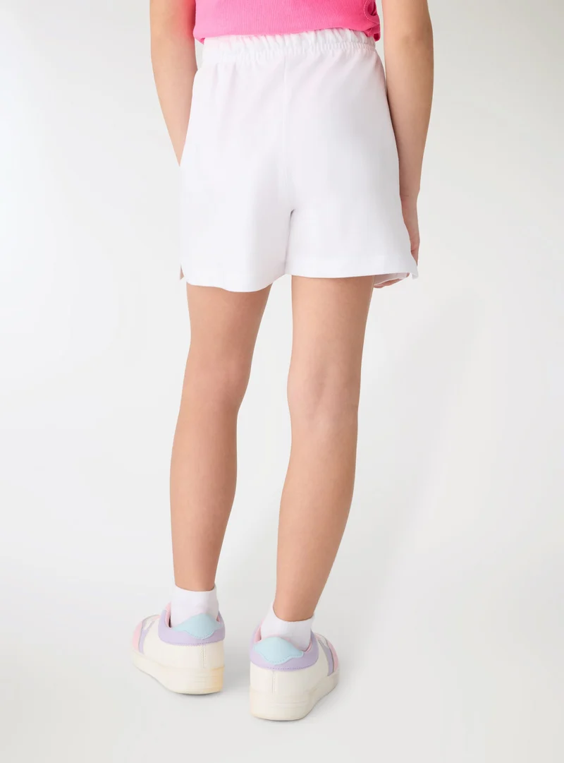 Shorts a tinta unita con elastico e coulisse