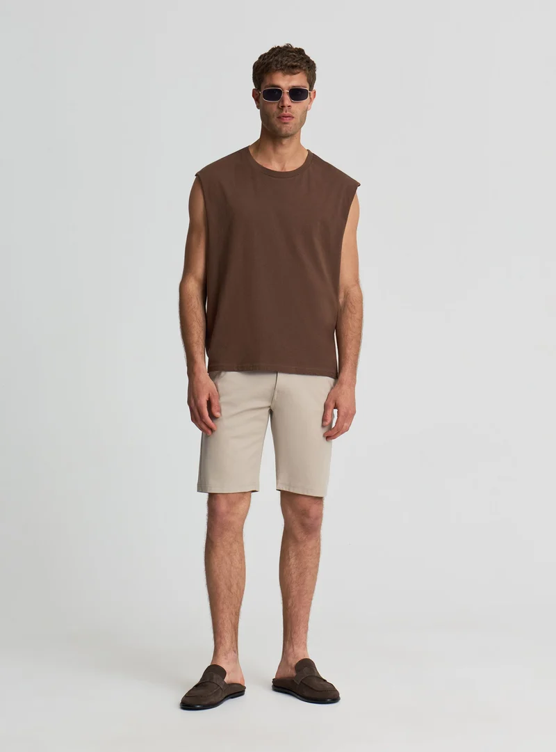 Pantaloncini chinos a tinta unita