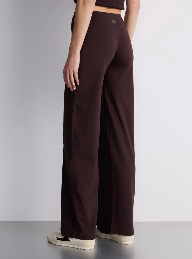 Leggings sportivo a gamba ampia tinta unita