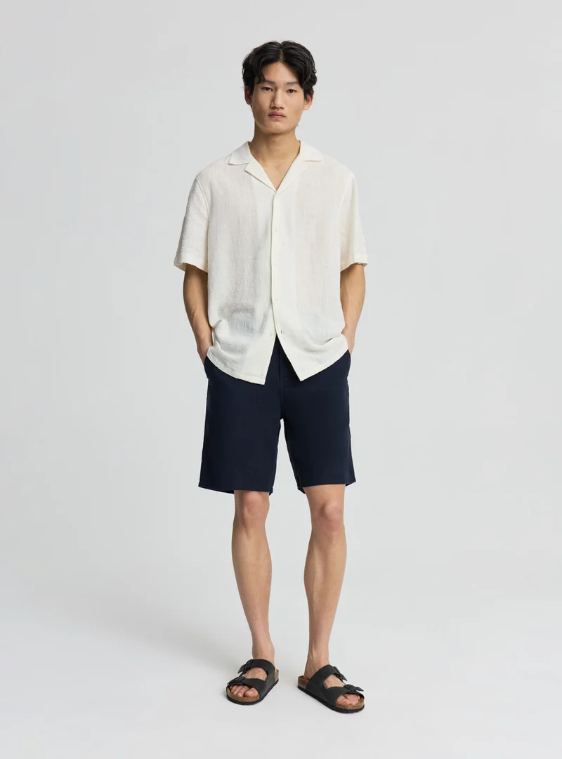 Pantaloncini chinos con coulisse effetto lino a tinta unita
