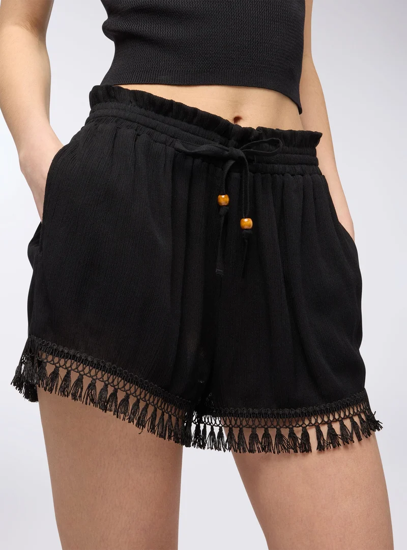Shorts con passamaneria