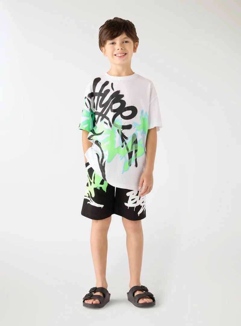 Pantaloncini tuta con stampa graffiti
