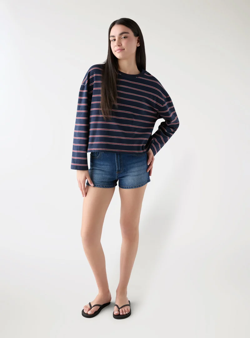 Jeans shorts con strappi