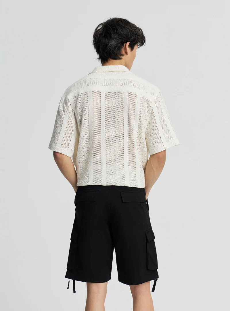 Pantaloncini cargo tinta unita
