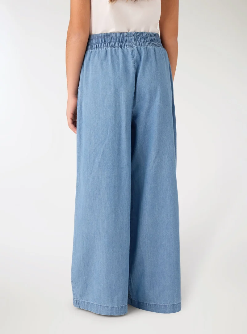 Jeans wide leg con coulisse