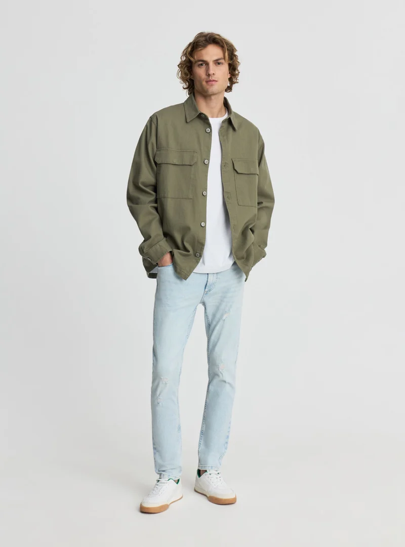 Jeans skinny con strappi