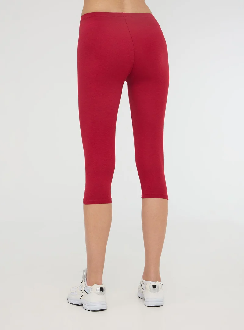 Leggings tre quarti tinta unita