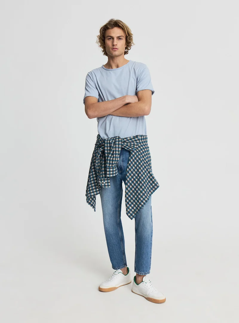 Jeans relaxed fit tinta unita