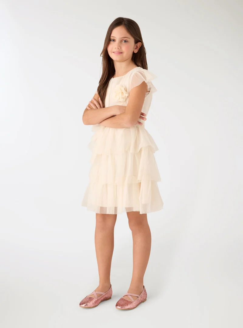 Vestito con balze e fiore applicato