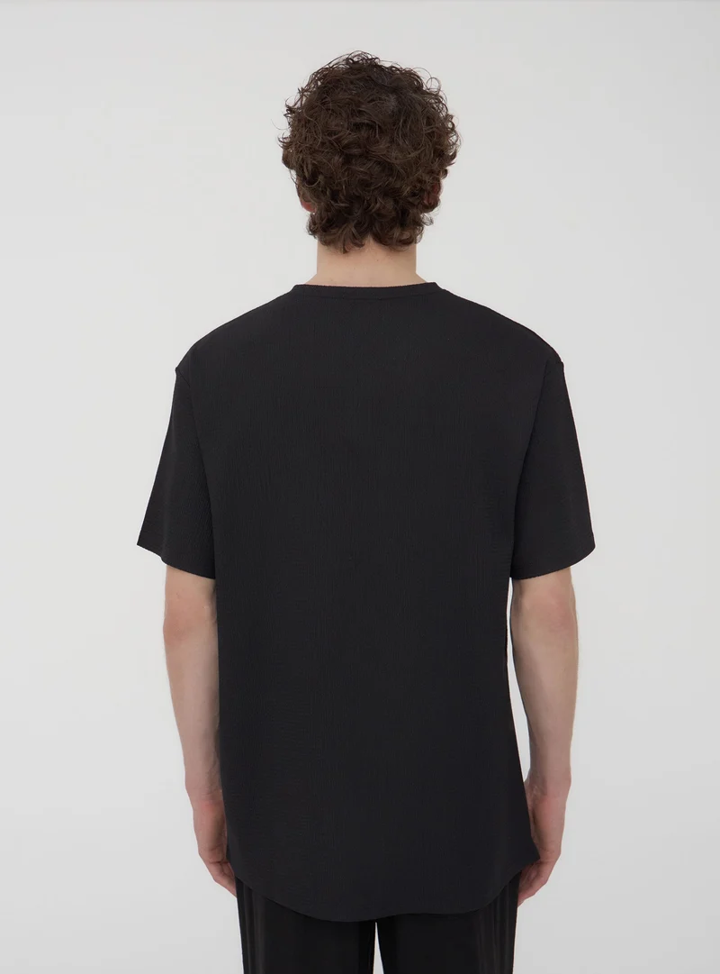 T-shirt tinta unita tessuto operato