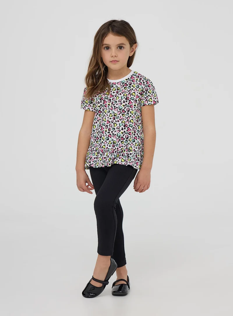 T-shirt fantasia maculata con cuoricini