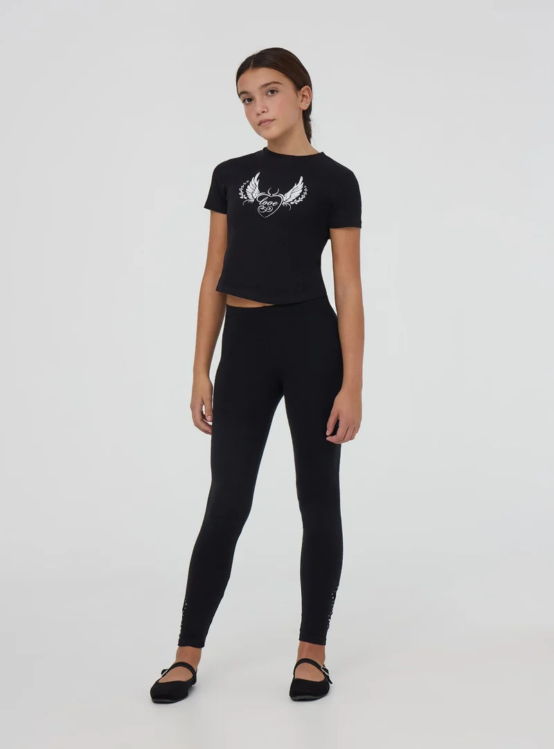T-shirt crop stampa rock con strass