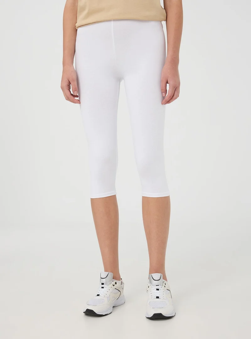 Leggings tre quarti tinta unita