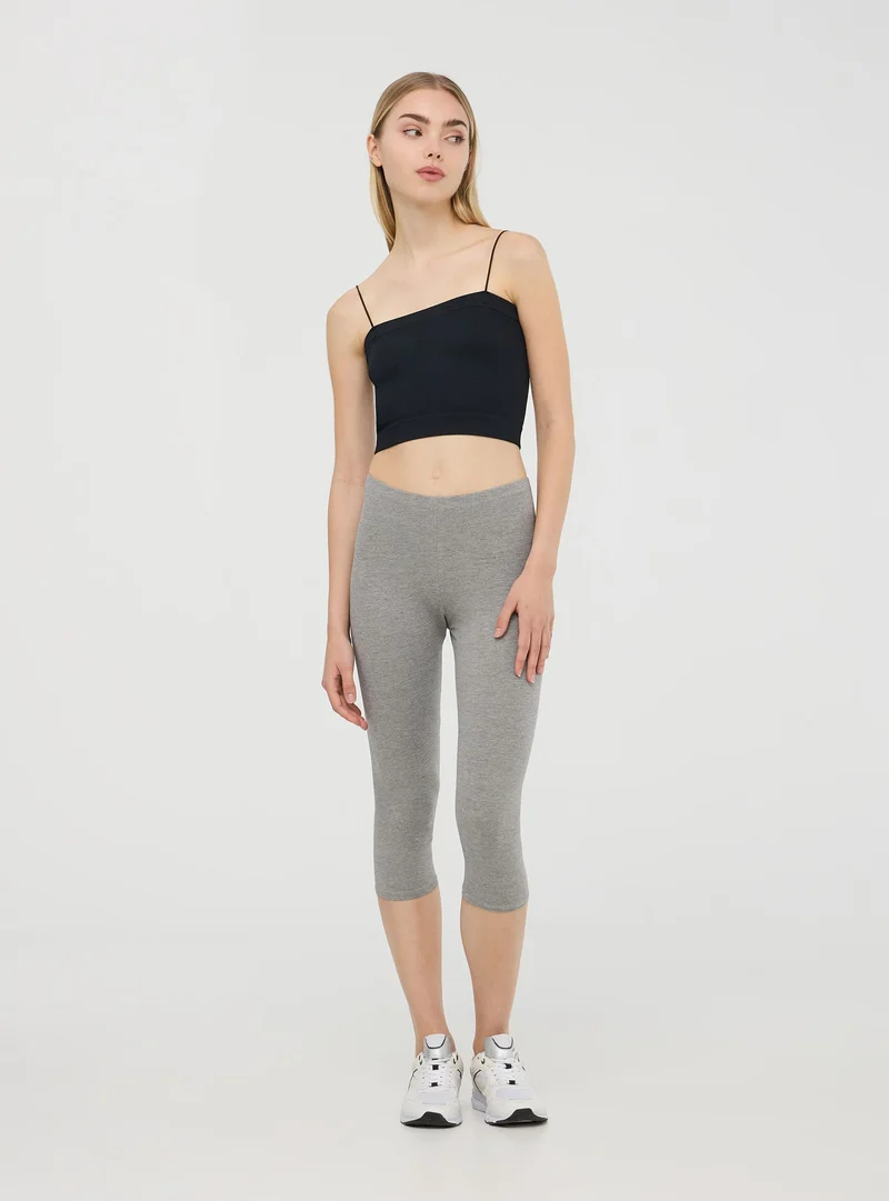 Leggings tre quarti tinta unita