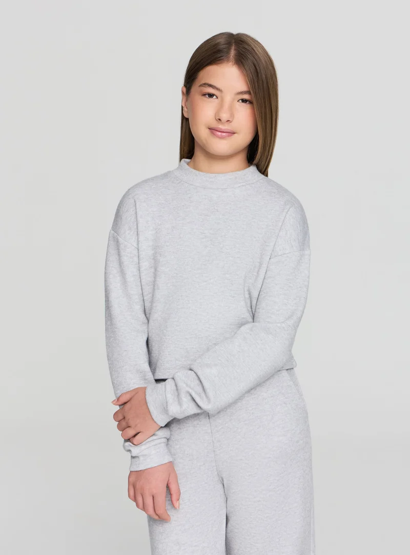 Maglietta crop con collo lupetto in tessuto caldo