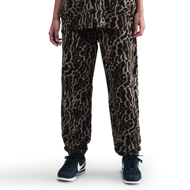 Nike Pantaloni tuta oversize stampati a vita alta – Donna Sp