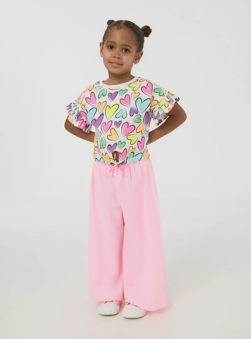 T-shirt crop con nodo e cuori multicolor