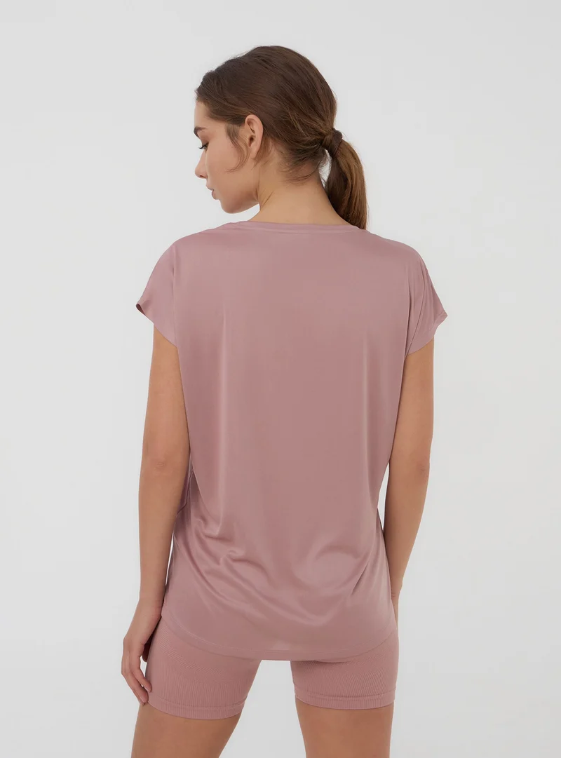 T-shirt sportiva ampia tinta unita