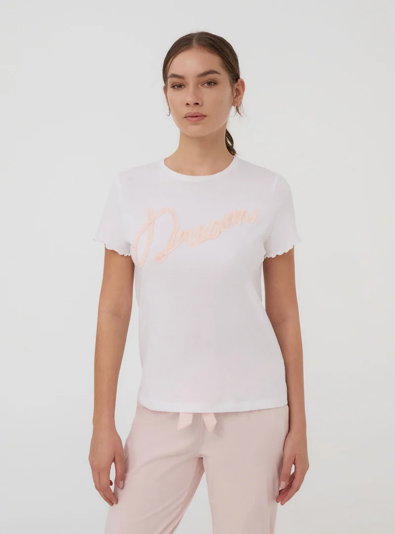 T-shirt del pigiama con scritta in tulle