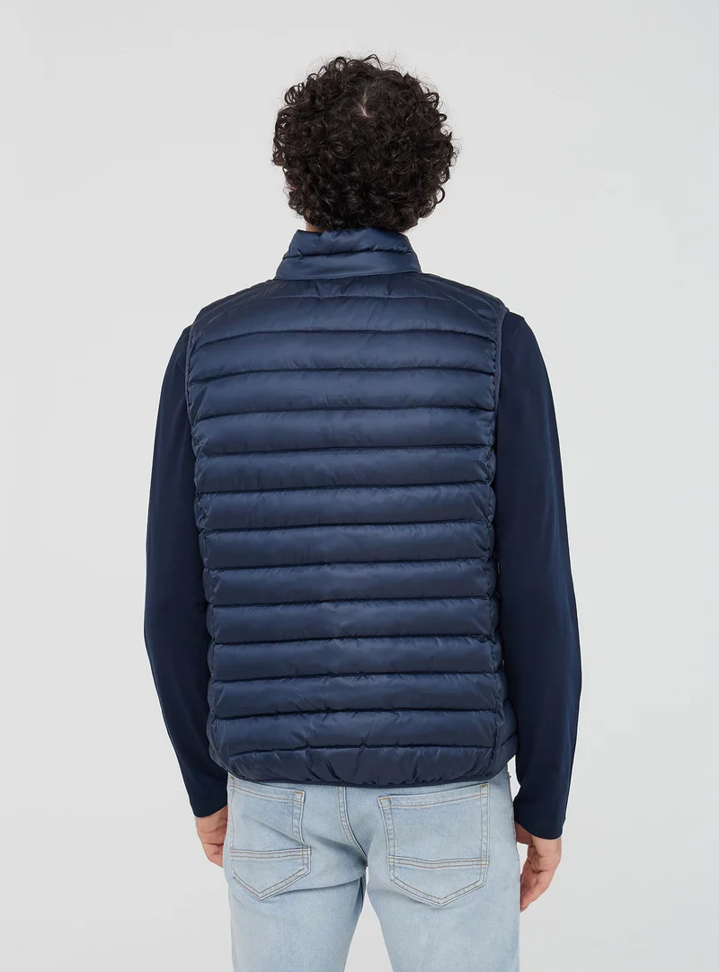 Gilet 100 grammi con collo alto