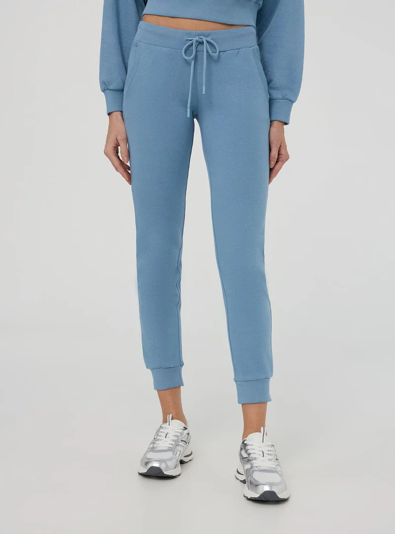 Pantaloni tuta leggeri con polsini e coulisse