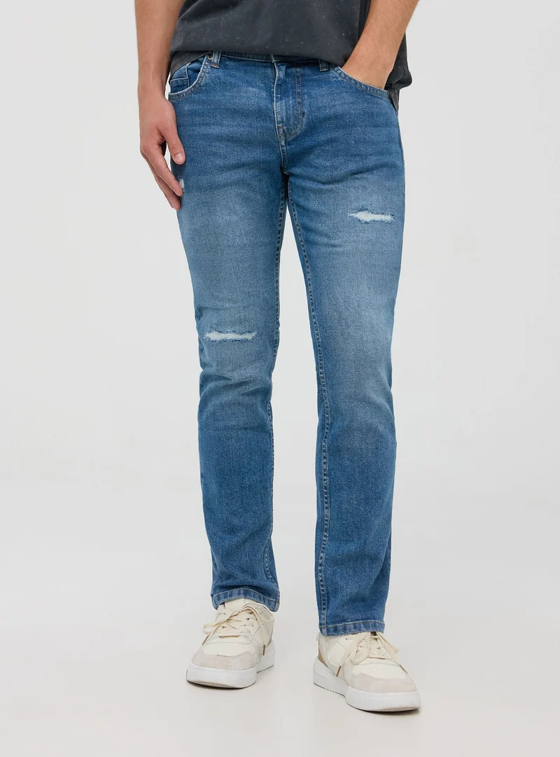 Jeans regular fit con strappi