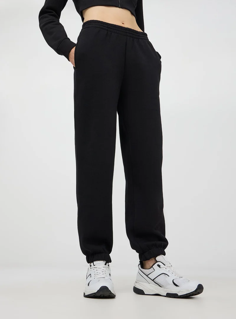 Pantaloni della tuta a vita alta con polsini
