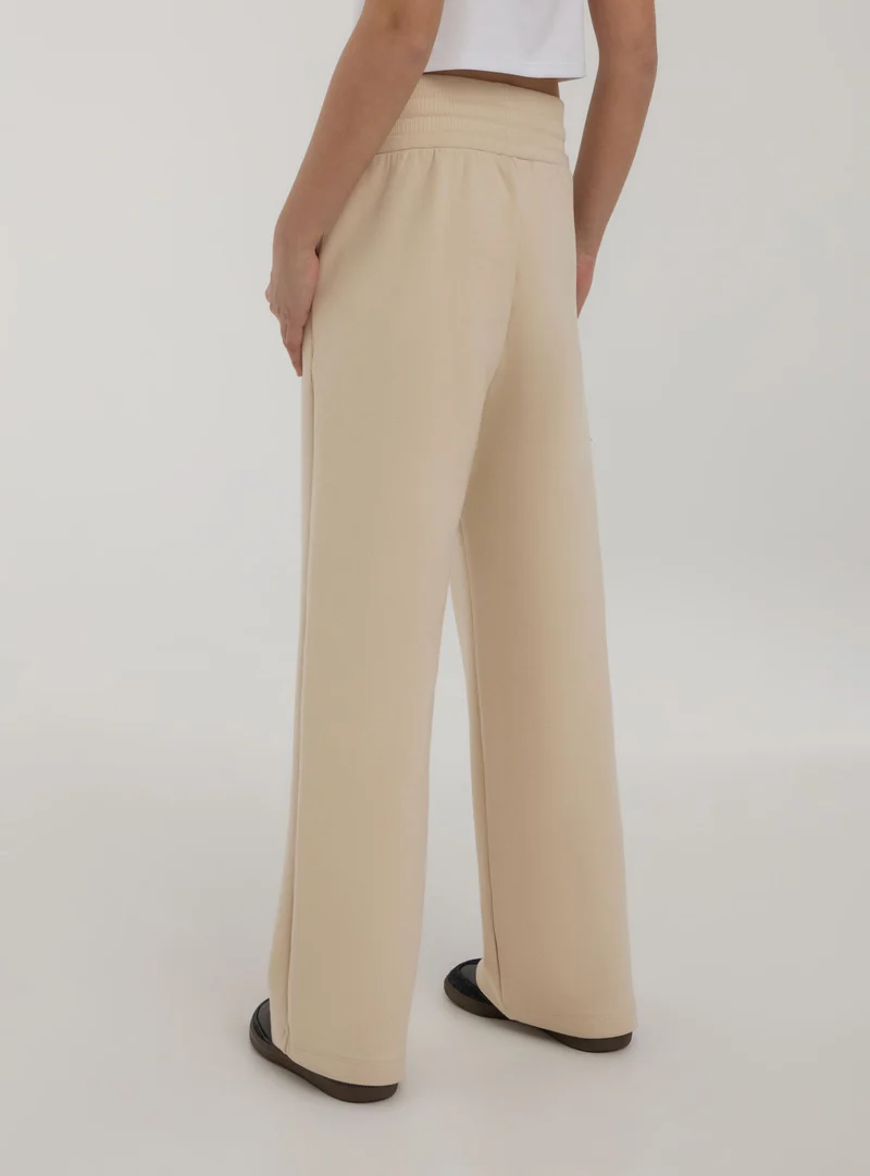 Pantaloni tuta wide leg con coulisse