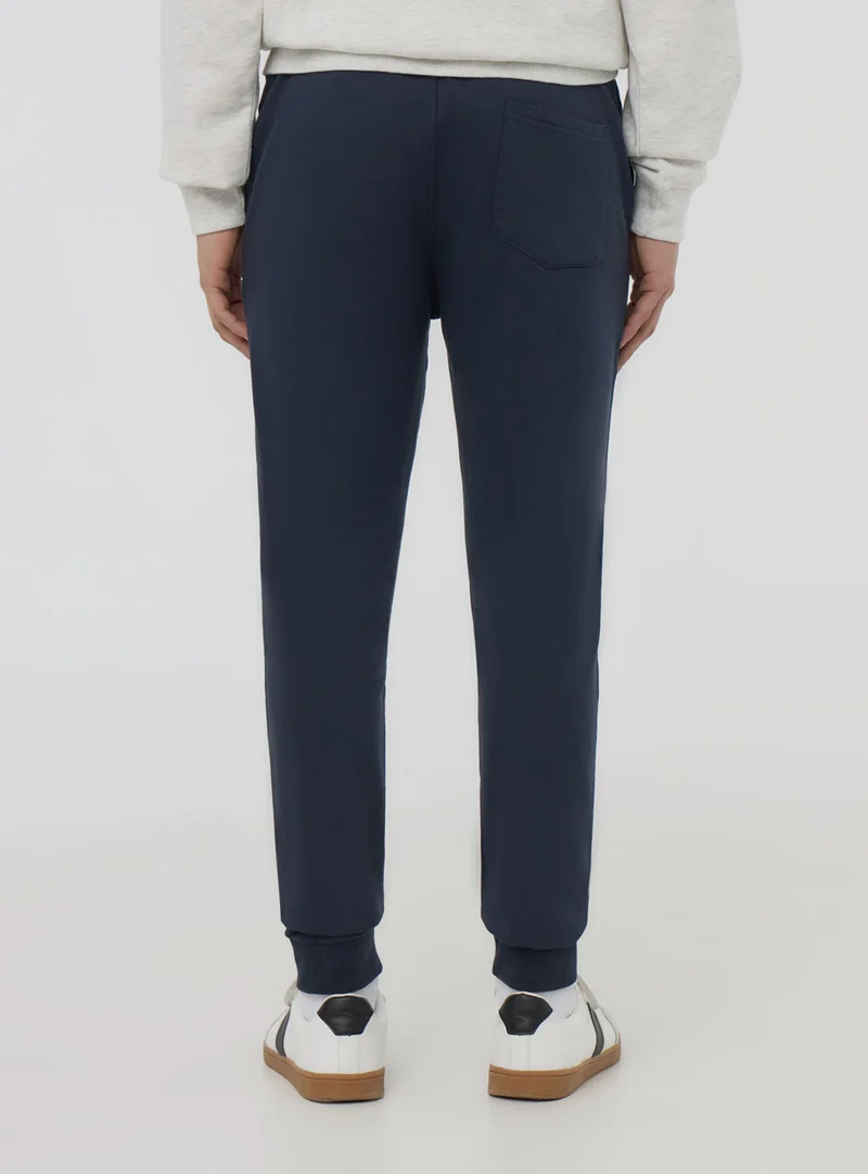 Pantaloni tuta leggeri skinny con polsini