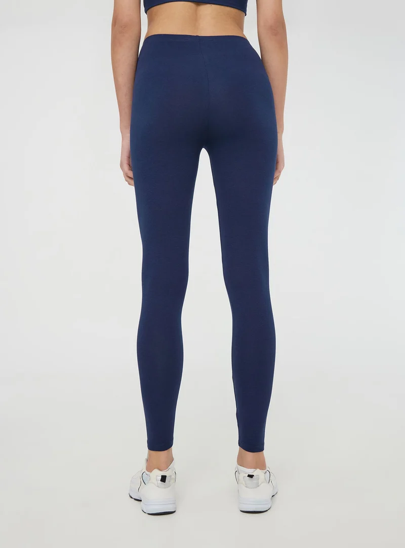 Leggings lunghi tinta unita in jersey stretch