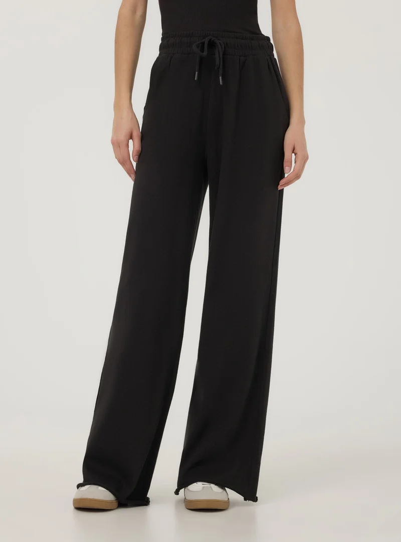 Pantaloni tuta wide leg con coulisse