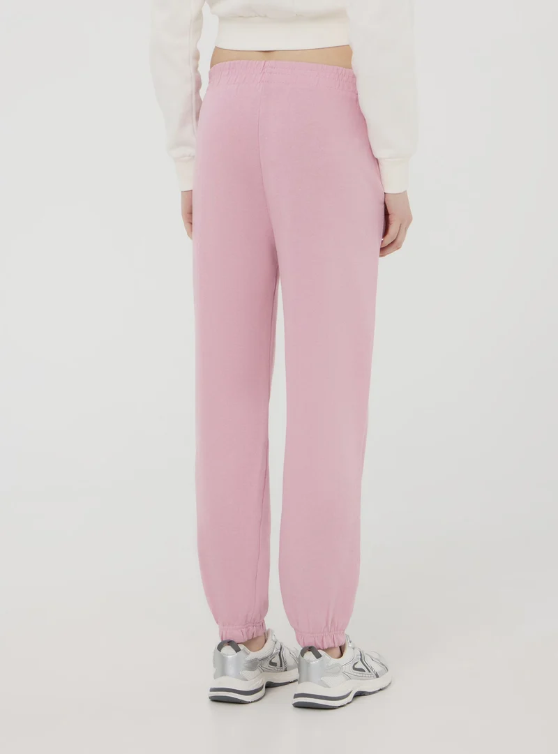 Pantaloni della tuta a vita alta con polsini