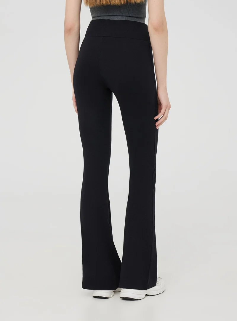 Leggings a zampa tinta unita