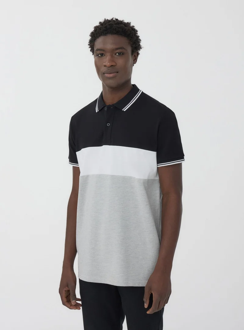 Polo in piquet block color