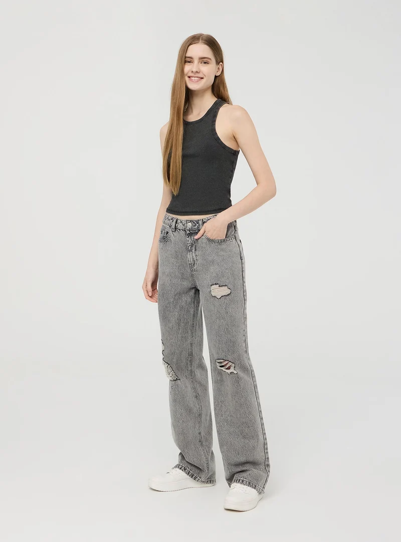 Jeans wide leg con strappi ampi